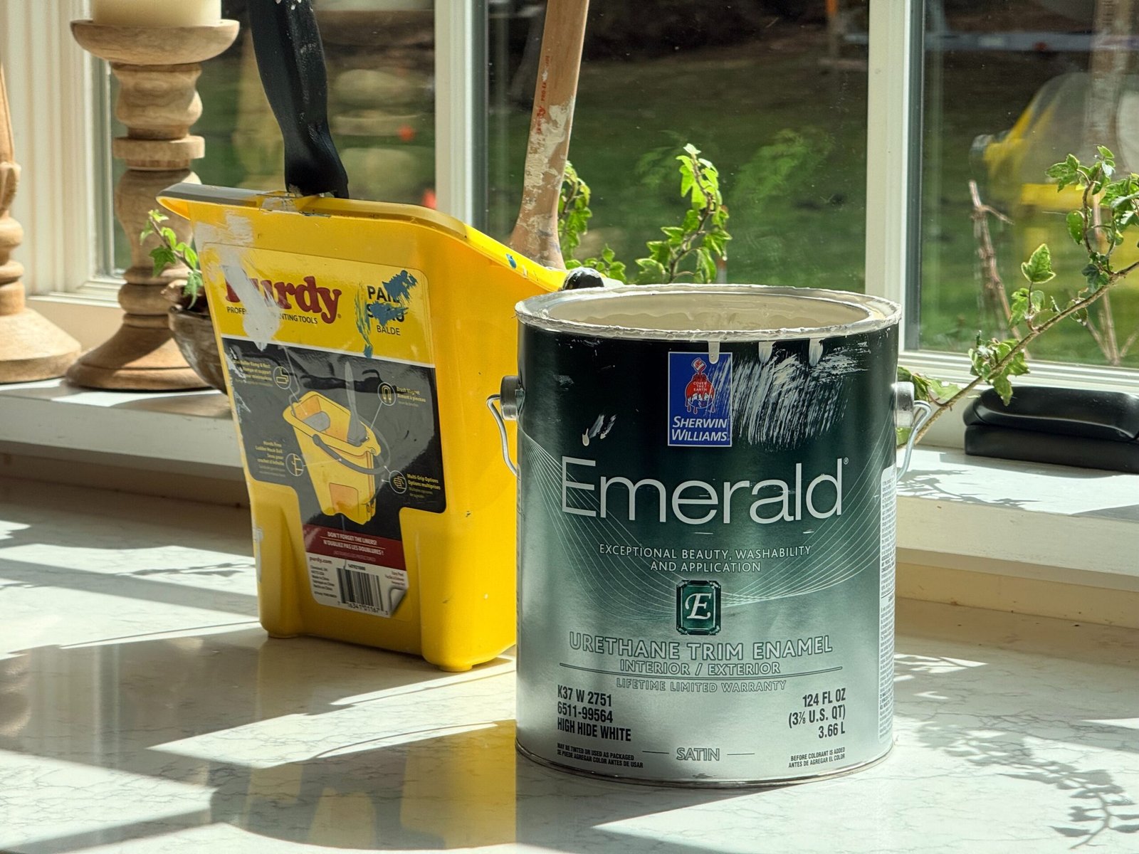 Cans of paint ready for a job
